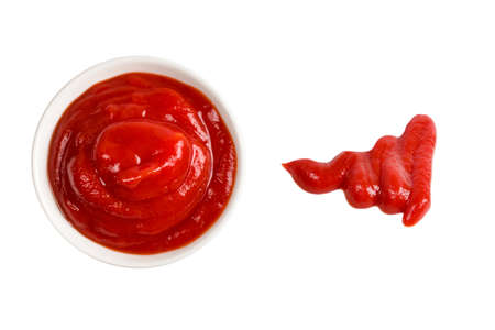 Ketchup in white plate on white background.の写真素材