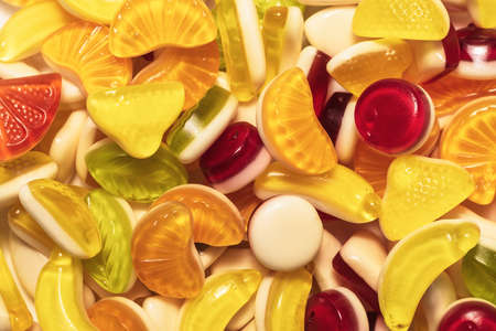 Assorted tasty gummy candies. Top view.
