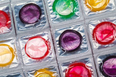 Colorful condoms background. Top view.の写真素材