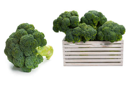 Fresh tasty broccoli in wooden box isolated on white background.の写真素材