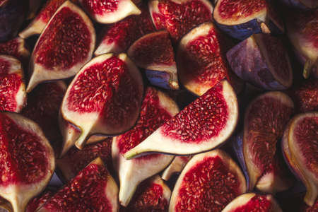 Tasty figs background. Top view. Slices.