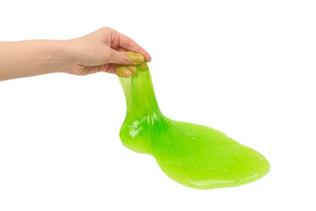 Green slime toy in woman hand isolated on white background.