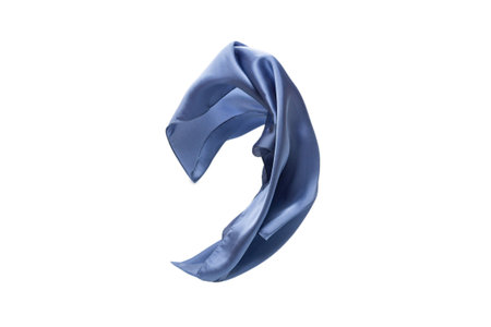 Flowing blue silk scarf isolated on white background.の写真素材