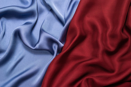 Red and blue silk or satin luxury fabric texture. Top view.の写真素材