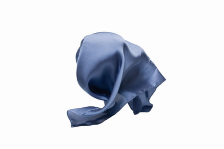 Flowing blue silk scarf isolated on white background.の写真素材