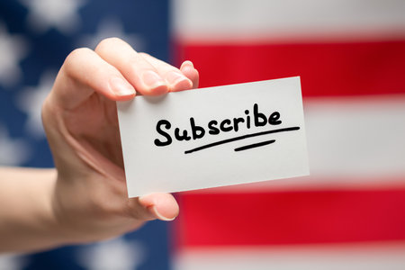 Subscribe text on a card. American flag background.の写真素材