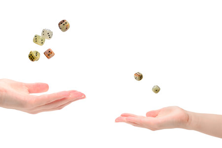 Woman throws dices isolated on white.の写真素材