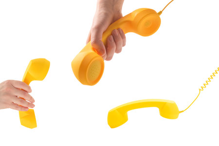 Yellow handset isolated on white. Copy space.の写真素材