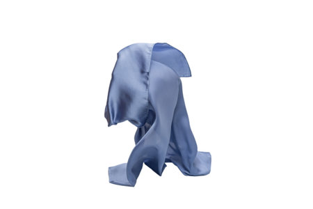 Flowing blue silk scarf isolated on white background.の写真素材