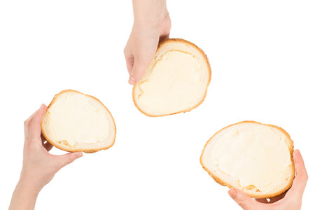 Tasty bread and butter in woman hand isolated on white background.