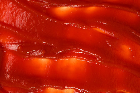 Red sauce splashes as background.