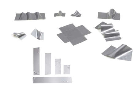 Silver scotch tape pieces isolated on white background.の写真素材