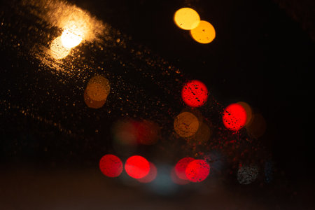 Blurred background with raindrops and lights.の写真素材