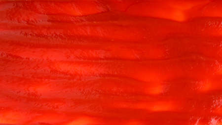 Red sauce splashes as background.