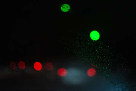 Blurred background with raindrops and lights.