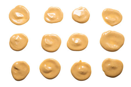 Mushroom sauce splashes isolated on white background. Top view.