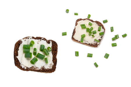 Brown bread and cheese isolated on white background.の写真素材