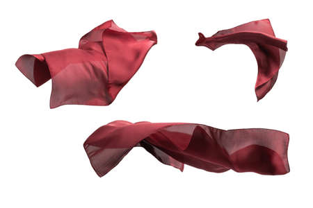 Flowing red silk scarf isolated on white background.の写真素材