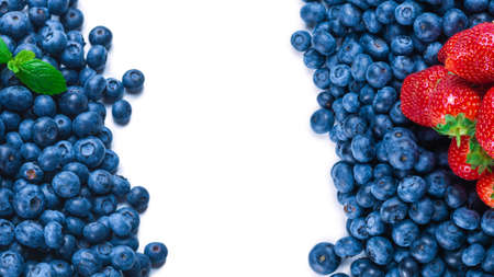 Blueberries and strawberries background. Top view.の写真素材