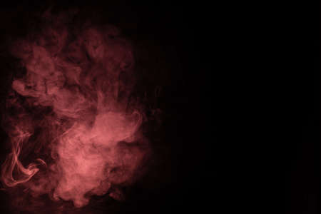 Green and pink steam on a black background. Copy space.の写真素材