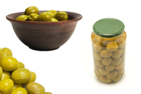 Olives in ceramic brown bowl isolated on white background.の写真素材
