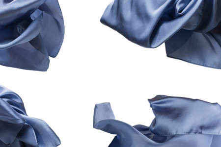 Flowing blue silk scarf isolated on white background.の写真素材