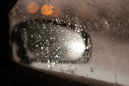 Blurred background with raindrops and lights.