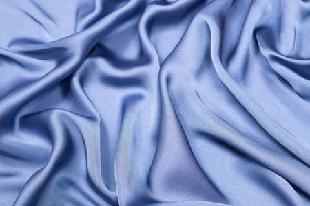 Blue silk or satin luxury fabric texture. Top view.の写真素材