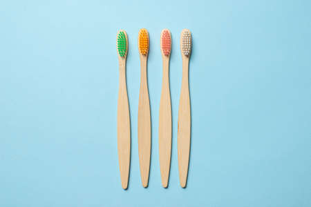 Bamboo toothbrush on a blue background. Top view.の写真素材