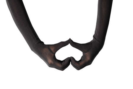 Woman in long black gloves isolated on a white background. Heart symbol.の写真素材