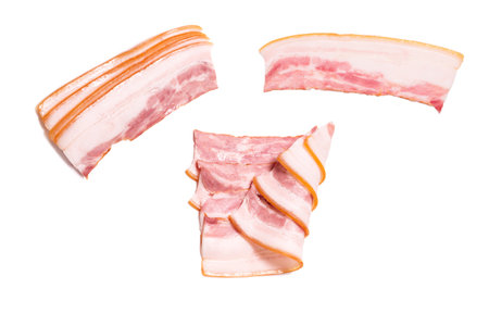 Raw bacon slices isolated on a white background. Top view.の写真素材