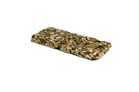 Bar with nuts isolated on a white background. Pumpkin seeds bar. Top view.の写真素材