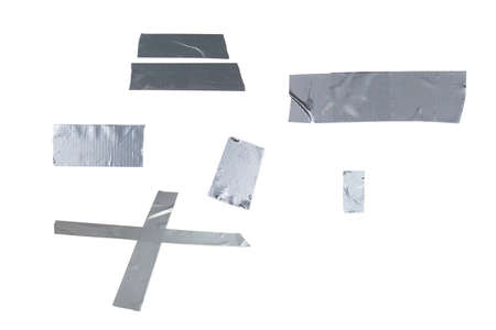 Silver scotch tape pieces isolated on white background. Top view.の写真素材