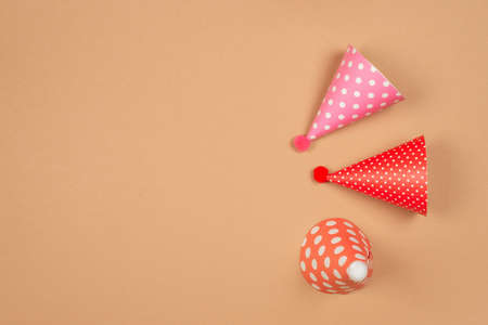 Colorful birthday cap on brown background. Copy space.の写真素材