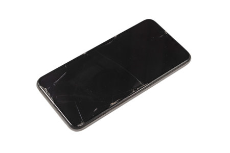 Smart phone with broken screen. isolated on a white background. Top view.の写真素材