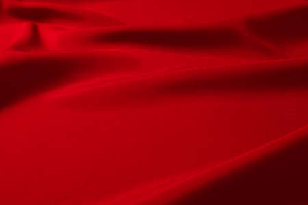 Red silk or satin luxury fabric texture can use as abstract background. Top view.の写真素材