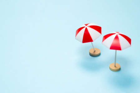 Red umbrella on a blue background. Copy space.の写真素材