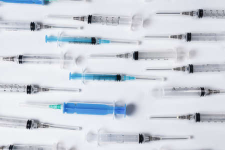 Many medical syringes as a background. Medical equipment.の写真素材