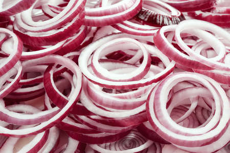 Onion rings as a background. Top view.の写真素材