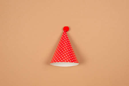 Colorful birthday cap on brown background. Copy space.の写真素材