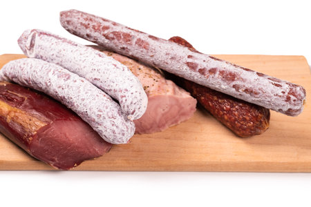 Various of meat, smoked meat, sausage, salami isolated on a white background.の写真素材