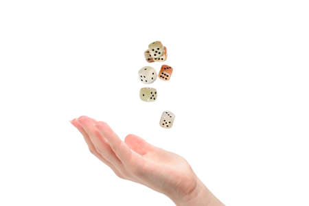 Woman throws dices isolated on white.