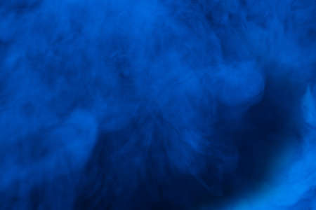 Blue steam on a black background. Copy space.の写真素材