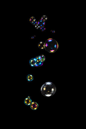Soap bubbles isolated on a black background. Copy space.
