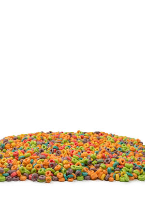 Sweet multicolored flakes, cereal loops. Isolated on a white background.の写真素材