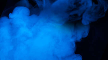 Blue steam on a black background. Copy space.の写真素材