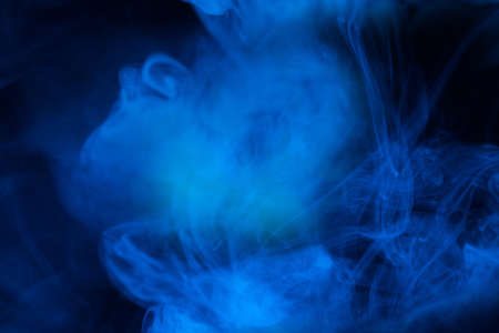 Blue steam on a black background. Copy space.の写真素材