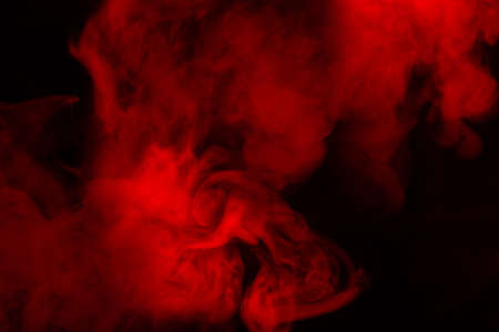 Red steam on a black background. Copy space.の写真素材