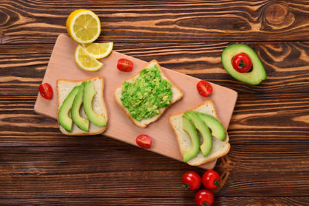 Avocado sandwich on a bread made with fresh sliced avocados from above