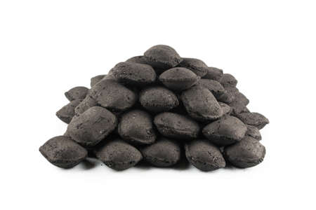 Black oak coal isolated on a white background.の写真素材